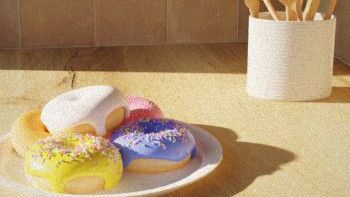 Donuts on the counter blanketed in a warm morning sun